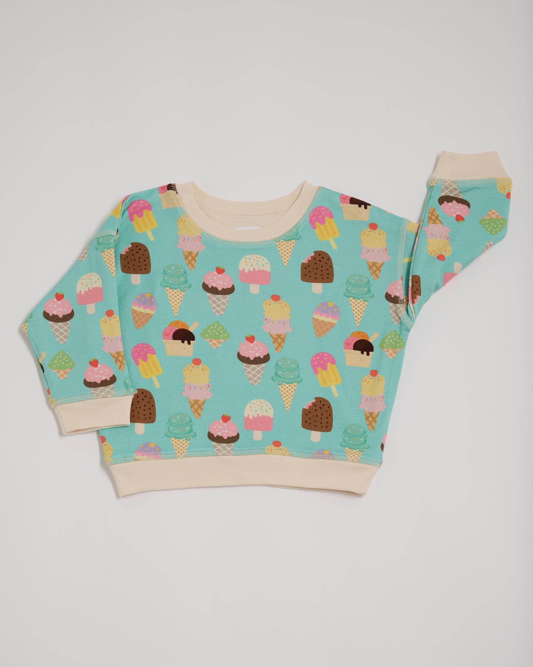 Front of sweatshirt featuring an all over turquoise ice cream print with contrast vanilla neck and sleeve trim.