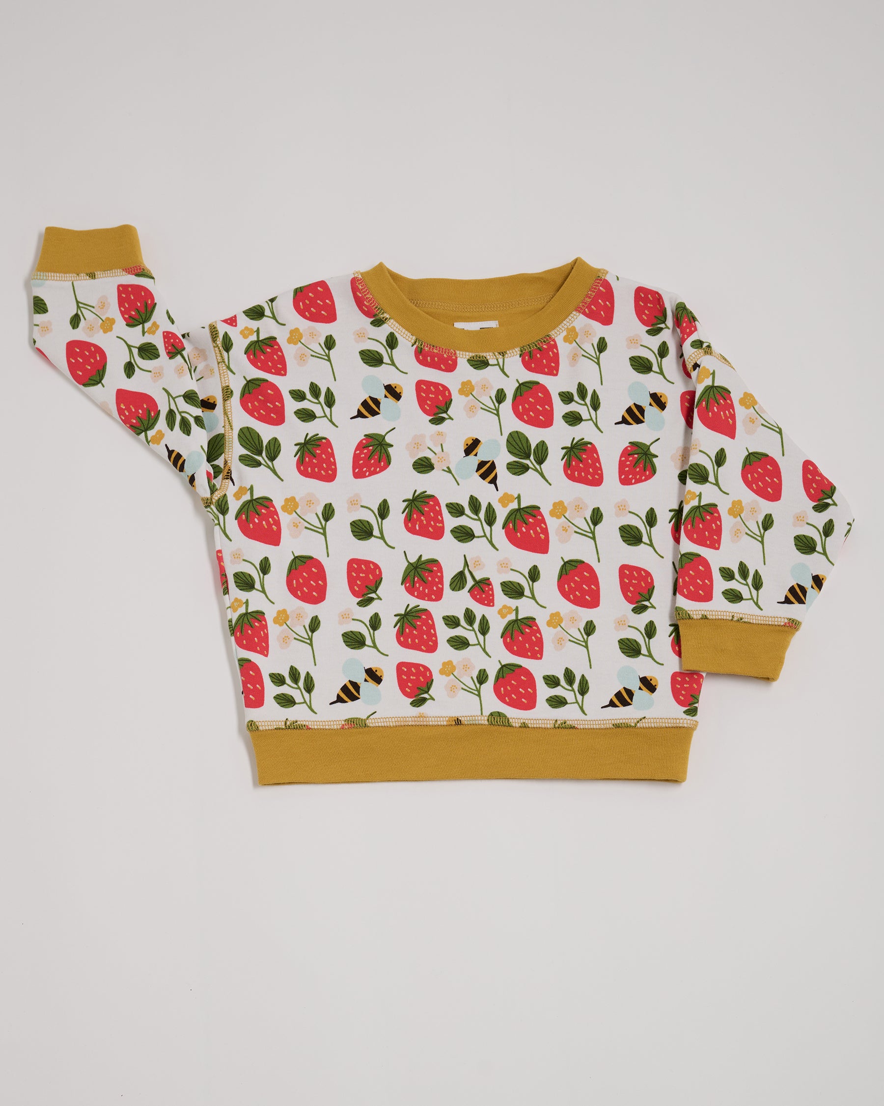 Front of sweatshirt featuring an all over strawberry and bees print with contrast honey neck and sleeve trim.