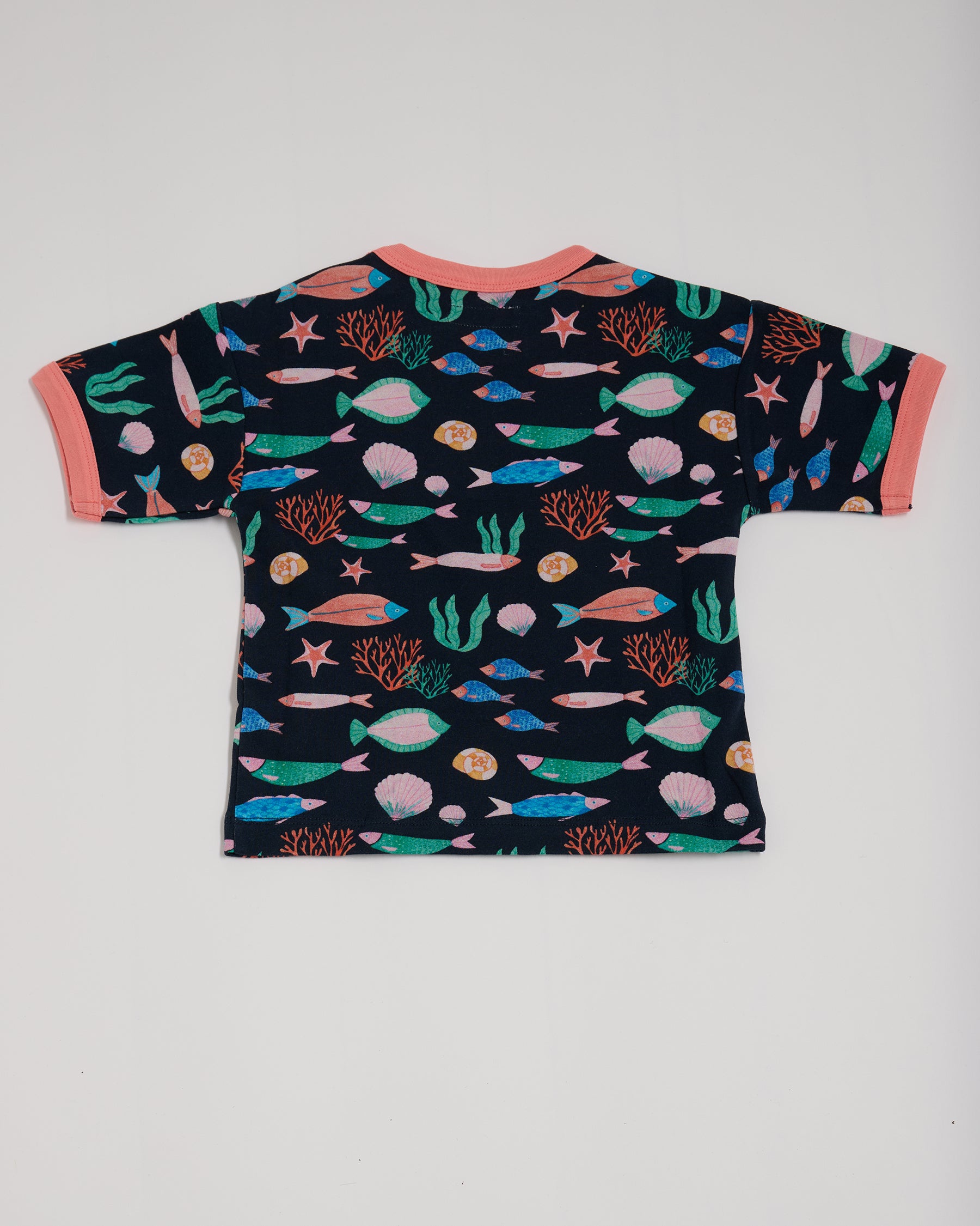 Back of short sleeved t-shirt featuring an all over vibrant navy fish print with contrast coral neck and sleeve trim.