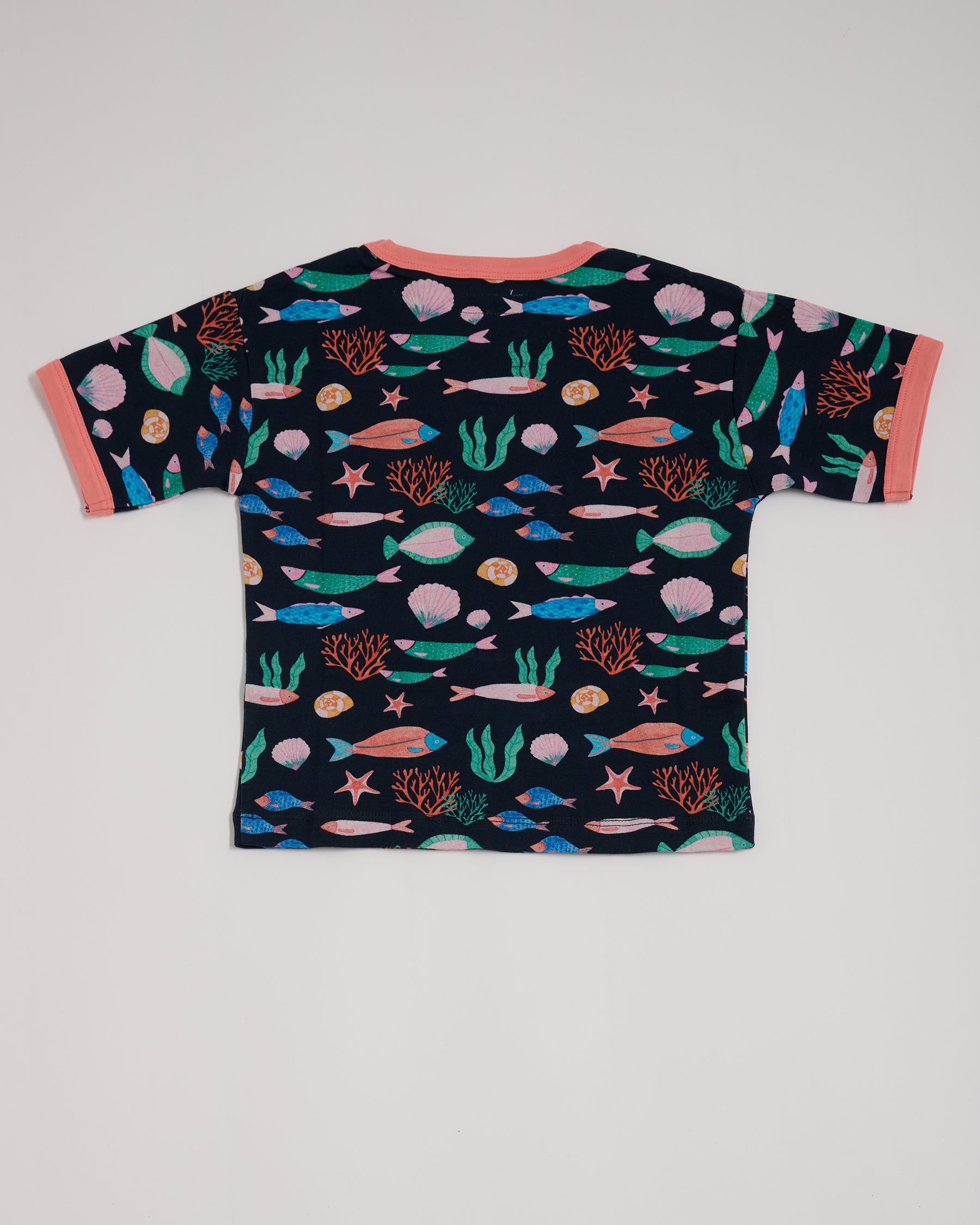 Back of short sleeved t-shirt featuring an all over vibrant navy fish print with contrast coral neck and sleeve trim.