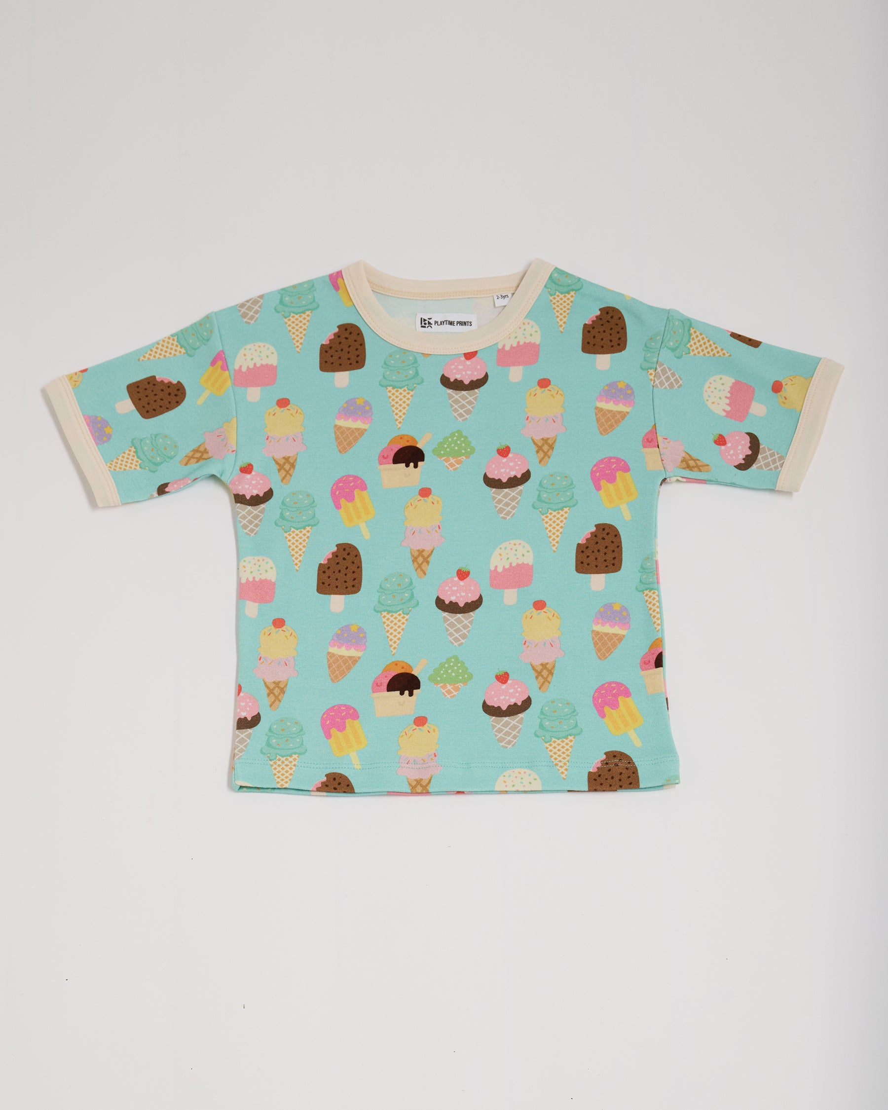 Front of short sleeved t-shirt featuring an all over turquoise ice cream print with contrast ecru neck and sleeve trim.