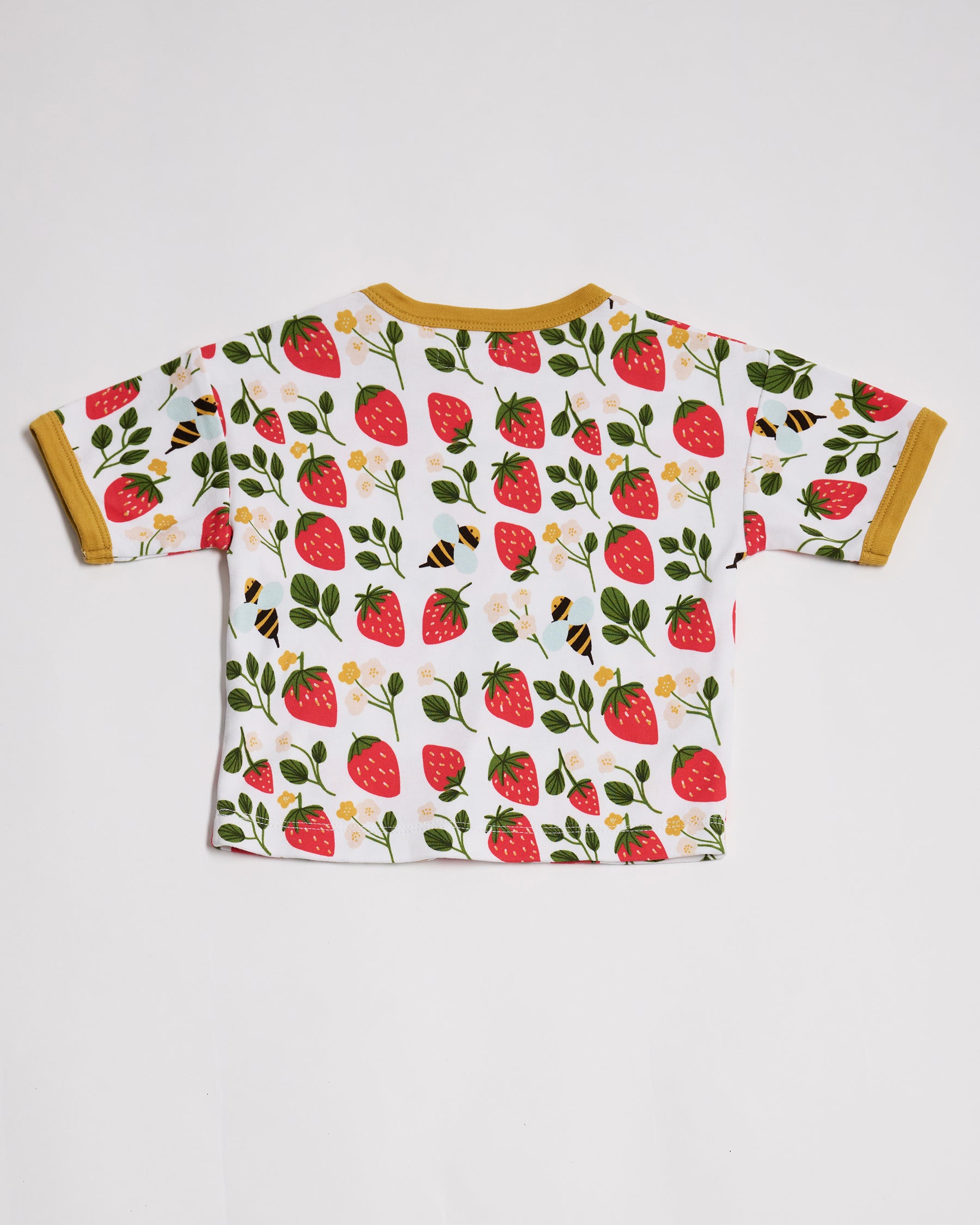 Back of short sleeved t-shirt featuring an all over strawberry and bees print with contrast honey neck and sleeve trim.