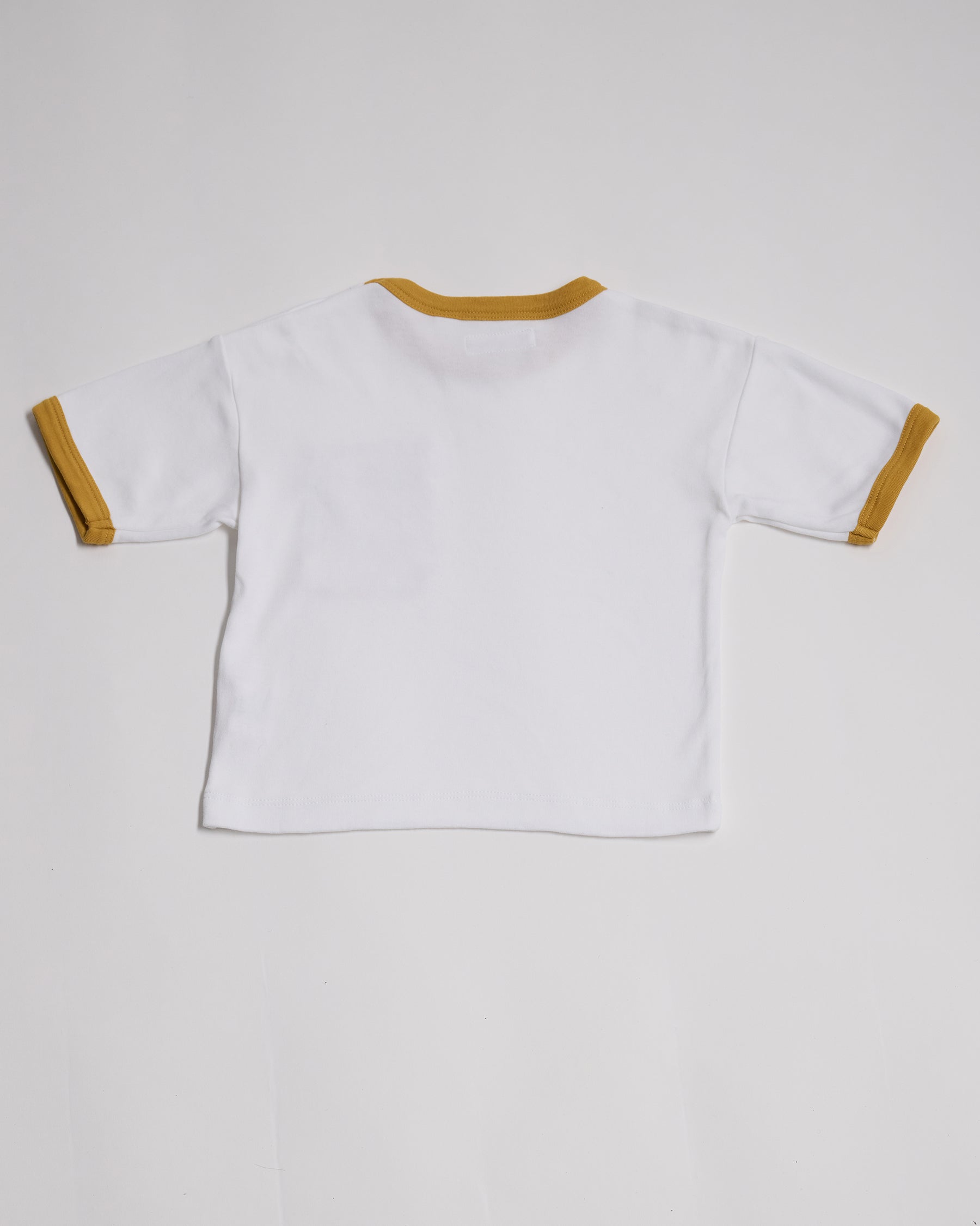 Back of white short sleeved t-shirt with honey neck and sleeve trim.